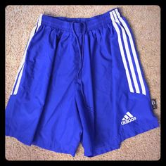 Sweat-Wicking Shorts That Handle Sustained Action. These Junior Boys' Shorts Rise To The Call With Climalite Fabric That Moves Moisture Away From Your Body. With 3-Stripes Down The Legs And An Adidas Logo For Classic Style. 7" Inseam (Size Med) Climalite Fabric Sweeps Sweat Away From Your Skin Drawcord On Elastic Waist Embroidered Adidas Logo At Left Hem; 3-Stripes Down Sides 100% Polyester Double Knitted Adidas Blue Athletic Shorts With Built-in Liner, Adidas Blue Shorts For Summer, Adidas Blue Cotton Shorts, Adidas Beach Shorts For Summer, Adidas Summer Beach Shorts, Adidas Blue Shorts, Adidas Bottoms, Boys Shorts, Blue Adidas