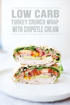 two turkey and lettuce wrap with chipotle cream on a white plate