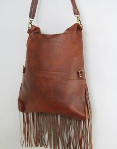 Brown Tasseled Hobo Bag, Brown Tasseled Crossbody Hobo Bag, Bohemian Brown Shoulder Bag With Fringe, Brown Fringe Hobo Shoulder Bag, Brown Crossbody Hobo Bag With Tassels, Brown Fringe Tote Shoulder Bag, Festival Brown Hobo Bag With Fringe, Everyday Bohemian Shoulder Bag With Tassels, Brown Fringe Hobo Bag For Festival