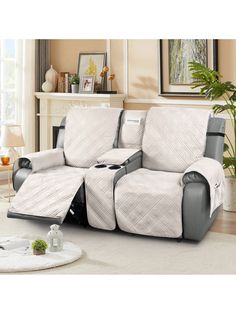 the reclining loveseat is covered in white and gray fabric