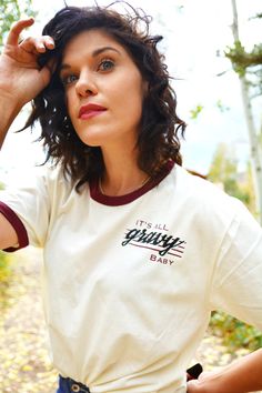 "This retro \"It's All Gravy Baby\" Graphic Tee is unisex sizing and made to order. It is so soft and breathable and a perfect addition to your fall closet ! This shirt features a 70s vintage design made of high quality vinyl on a comfy ringer tee with maroon collar and sleeves. Since this graphic tee is unisex, it typically runs large for women! This shirt has been laundered to reduce shrinkage. *WASHING INSTRUCTIONS* - For the design on the shirt to last as long as possible, it is recommended Retro Cotton Tops For Everyday, Retro Cotton Tops For Everyday Wear, Retro Letter Print T-shirt For Everyday, Retro Tops With Letter Print For Everyday, Unisex Vintage Tops With Text Print, Unisex Retro Cotton T-shirt, Unisex Vintage Text Print Tops, Vintage Unisex Text Print Tops, Vintage Text Print Unisex Tops