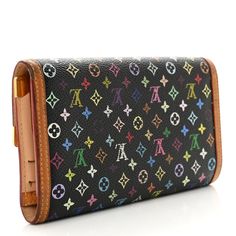 This is an authentic LOUIS VUITTON Monogram Multicolor Porte Tresor International Wallet in Black. The wallet is crafted of multicolored Louis Vuitton monogram in 33 vivid colors on black toile canvas with signature vachetta cowhide leather trim and brass corner detailing. The flap opens to a beige leather interior with pockets, an envelope compartment, and card slots. Black Toile, Brass Corners, Black Louis Vuitton, Louis Vuitton Wallet, Leather Interior, Leather Trim, Authentic Louis Vuitton, Cowhide Leather, Leather Trims