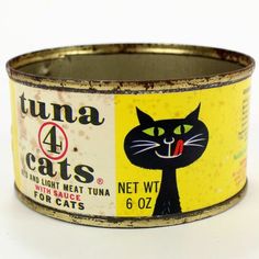 an old tin can with a black cat on it's side and the words tuna 4 cats