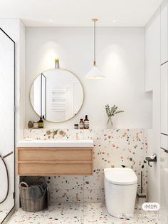 a bathroom with a toilet, sink and mirror