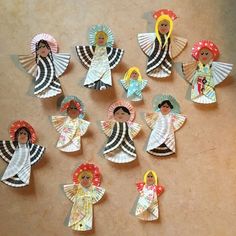 paper dolls are arranged in the shape of angel's and sunbursts