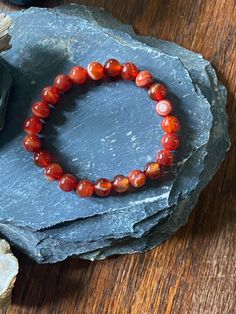 Gorgeous round 8mm carnelian crystal beads make up this beaded bracelet on nylon string.  ✨This bracelet fits a size 7 wrist but can be custom sized by request.✨  Check out my other crystal bracelets here:  https://www.etsy.com/your/shops/aprilbellavita/tools/listings/query:bracelet Carnelian Crystal Bracelet, Orange Carnelian Round Beaded Bracelets, Spiritual Carnelian Orange Bracelets, Red Carnelian Bracelets With 8mm Beads, Bohemian Carnelian Hand-strung Bracelets, Carnelian Crystal, Crystal Bracelets, How To Make Beads, Crystal Beads