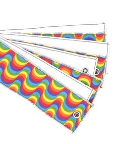 four pieces of cloth with different colors and shapes on them, each featuring a wavy design