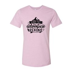 Planning a great travel adventure or embarking on a new season in life? Then this adorable graphic tee is for you! Emblazoned with the phrase, "And so adventure begins," this t-shirt is an excellent reminder to embrace the unknown and go after your dreams! Available in XS - 3X in a variety of colors. Ships worldwide FREE SHIPPING TO US CUSTOMERS Note: This product is an Embark Select item. Embark gift cards and promotions apply! Artisan's Description: This Unisex T-shirt is crafted from ring spu Graphic Tee With Text Print For Adventure, Adventure Letter Print Short Sleeve T-shirt, Adventure T-shirt With Letter Print And Short Sleeves, Pre-shrunk Tri-blend T-shirt For Outdoor Activities, Pre-shrunk Crew Neck T-shirt For Adventure, Graphic Tee For Adventure, Adventure Graphic Tee With Crew Neck, Graphic Tee Crew Neck For Adventure, Pre-shrunk Graphic Tee For Hiking