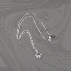 This beautiful crystal butterfly necklace is made with a dainty silver-plated crystal encrusted butterfly pendant and is suspended on a sterling silver chain with a sterling silver clasp. The necklace is available in five necklace lengths, please choose the necklace length you need from the drop-down menu. The necklace will arrive in an attractive gift box. Silver Butterfly Necklace With Butterfly Clasp, Delicate Silver Butterfly Necklace With Clavicle Chain, White Gold Necklace With Butterfly Charm, White Gold Necklace With Butterfly Charm In Sterling Silver, White Gold Sterling Silver Necklace With Butterfly Charm, Silver Sterling Butterfly Necklace With Butterfly Clasp, Silver Sterling Butterfly Necklace, Delicate Sterling Silver Butterfly Necklace In White Gold, Sterling Silver Butterfly Necklace In White Gold