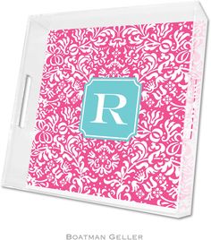 a pink and blue monogramed tray with the letter r on it