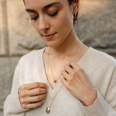 The Precious Pebble Necklace is the sister to our cherished Worry Stone Necklace. Designed to harness the grounding power of touch, this necklace invites you to hold, touch, and rub it, providing a precious moment to yourself. Suspended on a 20" chain, it effortlessly layers with the Worry Stone Necklace for a versatile, harmonies look. Hand-poured and intentionally unpolished, each necklace boasts a one-of-a-kind texture, celebrating the beauty of uniqueness. Timeless Jewelry With Oval Pendant Cable Chain, Everyday Yellow Gold Teardrop Pendant Necklace, Everyday 14k Gold Oval Pendant Necklace, Everyday Recycled Gold Pendant Necklaces, Everyday Recycled Gold Pendant Necklace, Everyday Pendant Necklace In Recycled Gold, Everyday Tarnish Resistant Teardrop Pendant Necklace, Timeless Pendant Necklaces With Cable Chain, Minimalist Brass Teardrop Pendant Necklace