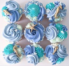 cupcakes decorated with blue and white frosting, seahorse on the top