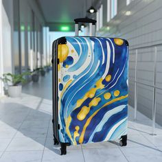 Looking for the perfect luggage to make a statement while traveling? Look no further! Our premium travel luggage features a gorgeous abstract watercolor design in blue and yellow that is sure to turn heads at the airport. With fine art prints covering both the front and back, you'll never have to worry about losing your luggage again in a sea of boring black bags. But this luggage isn't just a pretty face. It's also highly functional, with an adjustable telescopic handle, four double-wheels with Modern Blue Travel Bag, Blue Luggage With Sleeve For Business Trips, Blue Travel Bag With Luggage Sleeve For Business Trips, Modern Blue Luggage For Business Trips, Modern Blue Travel Accessories With Luggage Sleeve, Jet Setter, Watercolor Design, Suitcases, Blue And Yellow