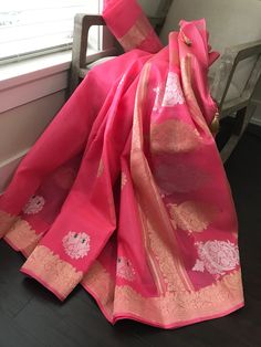 This is a beautiful handloom pure kora silk banarasi saree in a pleasant shade of bubblegum pink with kadwa sona rupa meenakari bird motifs in body, kadwa gold zari borders and sona rupa kadwa motifs in pallu. Saree comes with an unstitched blouse piece with motifs woven in kadwa technique. Falls, pico and tassels are done. Colour may vary slightly depending upon lighting. Handloom products may have some irregularities. All sales are final. Dry clean only. Anarkali Organza Saree For Traditional Ceremonies, Organza Anarkali Saree For Traditional Ceremonies, Traditional Drape Dupatta With Kora Details, Traditional Kora Dupatta, Organza Saree With Zari Weaving In Traditional Drape, Pink Organza Saree With Zari Weaving, Traditional Organza Dupatta With Zari Weaving, Pink Organza Saree With Self Design, Pink Self Design Organza Saree