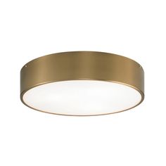 a round light fixture with a gold finish on an isolated white wall or ceiling surface