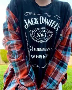 🍂🥃 Orangey Whiskey Drink Flannel🍂🥃   ~ Orange and Turquoise Flannel with a Black Jack Daniels Shirt  🥀Fits best: Unisex XL🥀 ✨Models: Female- is a Medium and is 5'2.  Male- is a L-XL and is 5'10 Whisky Drink, Jack Daniels Shirt, Long Beach Ny, Whiskey Drinks, Black Jack, Orange And Turquoise, Jack Daniels, Jack Black, Whiskey