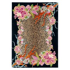 an animal print rug with flowers and leaves on black ground, in front of a white background