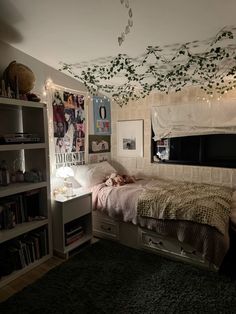 a bed room with a neatly made bed next to a book shelf