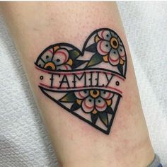 a heart tattoo with the word family on it