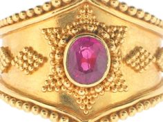 Etruscan styled opulence in high karat yellow gold with fine beaded detail along the outside of the band and in diamond formations surrounding a center oval-cut cherry red Burma ruby. Jewellery Marketing, Ruby Ring, 22k Gold, Cherry Red, Oval Cut, The Band, Ruby, Cherry, Ring Size