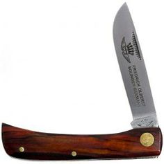 a knife that is sitting on top of a wooden handle