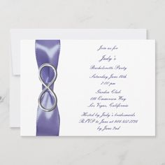 an elegant purple and white wedding card with a ribbon on the front, featuring two silver rings