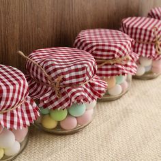 small glass jars filled with eggs and candy