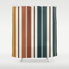 a colorful shower curtain with an arrow pattern on the front and side, in various colors