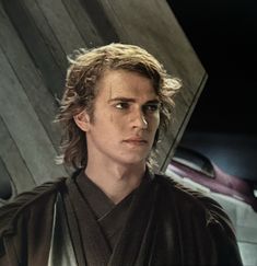 a man with long hair wearing a star wars costume