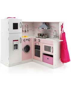 a doll house kitchen with pink appliances and accessories