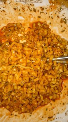 a bowl filled with macaroni and cheese on top of a table