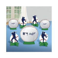 six baseballs with the dodgers logo on them are shown in front of a window