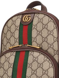 Height: 29cm Width: 20cm Depth: 5cm. Detachable adjustable strap. Single top handle. Zip closure. Front metal logo. Web detail. All over GG pattern placement may vary. Leather trim. Gold-colored metal hardware. One front zip pocket Designer Gucci Backpack With Zipper Closure, Gucci Luxury Backpack With Zipper Closure, Gucci Brown Backpack For Daily Use, Luxury Bags With Logo For On-the-go, Luxury Logo Bags For On-the-go, Gucci Shoulder Bag With Logo Hardware For Everyday Use, Luxury Backpack Shoulder Bag With Gold-tone Hardware, Gucci Brown Standard Backpack, Gucci Classic Backpack