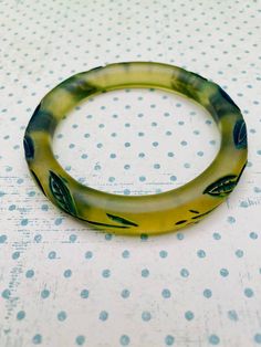 Very cool vintage bangle bracelet. Translucent green keeps this neutral enough to go with any outfit. Measures about a half inch in width. Excellent condition! Unique Green Bangle Bracelet, Green Bangle Bracelets With Patina, Vintage Resin Bracelet, Adjustable Green Vintage Bangle, Retro Green Bangle Bracelets, Lavender Stone, Room On The Broom, Vintage Bangle Bracelets, Resin Bangles