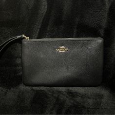 Coach Wristlet Like New, Tags Were Taken Off But Never Used Elegant Coach Pouch For Everyday, Black Clutch Pouch With Wrist Strap, Elegant Everyday Coach Pouch, Elegant Black Wristlet For Gift, Classic Pouch Wristlet For Daily Use, Classic Everyday Wristlet With Zipper Pouch, Classic Wristlet Pouch For Daily Use, Classic Clutch Wristlet For Everyday Use, Classic Clutch Wristlet For Daily Use