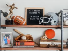 a shelf with sports memorabilia and other items on it