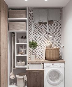 a washer and dryer in a small room next to a wall mounted shelf