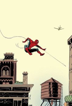 a spider man flying through the air over buildings