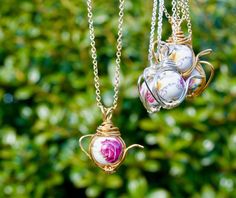 "For these necklaces, I wire wrapped rose printed beads and turned them into teapot shaped. I used gold plated wires and silver plated wires. Since each of these beads have slightly different rose patterns, I labeled each necklaces from #A to #E so please check all the photos( especially 2nd and 3rd photos since those photos show both sides) and select the one you would like to purchase. ==Size Information== pendant size as whole: varies but they are about 26mm( 1\") x 27mm( 1.1\")" Teapot Jewelry, Teapot Necklace, Wire Wrapped Rose, Rose Patterns, Rose Teapot, Pumpkin Necklace, Diy Jewelry Display, Talisman Necklace, Lovers Necklace