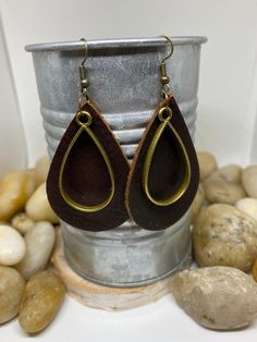 "Beautiful handmade item, real genuine leather earrings, includes a coordinating shape charm in a variety of metals and color options, bronze, silver and gold. Earring colors are black, rich cognac brown weathered leather and camel/mustard. Mustard is silver charm and hook Cognac brown is bronze charm and hook Black is gold charm and hook All available in round or teardrop. Round measures Aprox 1.5\" and teardrop Aprox 2\"" Everyday Leather Teardrop Earrings, Leather Teardrop Earrings For Everyday Use, Leather Teardrop Jewelry, Everyday Brown Jewelry With Waxed Finish, Leather Earrings As A Gift, Brown Waxed Finish Jewelry As Gift, Brown Jewelry With Waxed Finish As Gift, Brown Leather Teardrop Jewelry, Handmade Leather Teardrop Earrings