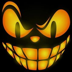 an image of a scary pumpkin with glowing eyes and fangs on it's face