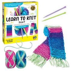 the kit includes yarn, scissors and knitting needles