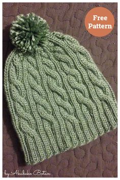 a green knitted hat with a pom - pom on top and the words free pattern below it