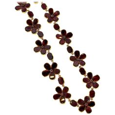 A feminine and lively necklace, that although is over 200 years old is a current and youthful necklace for today. Foiled back red garnets create five pointed flowers with oval garnets set in between. This Georgian necklace is made in 18k gold, there are no visible hallmarks. The necklace at the back was likely lengthened perhaps 100 years ago, as the floret pattern changes at the back. The necklace is 15.5 inches long and the widest flower is a little over 1/2 inch in diameter. Georgian Necklace, Victorian Pendant Necklace, Riviere Necklace, Pink Garnet, Georgian Jewelry, Victorian Pendants, Garnet And Gold, Turquoise Flowers, Victorian Gold