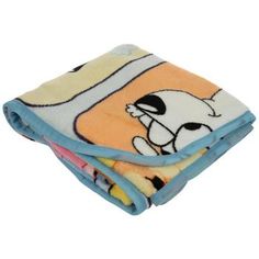 two blankets with cartoon characters on them are folded up in the shape of an animal