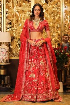 Blood red lehenga with 3D floral applique work and sequin embellishment. Comes with blouse, dupatta and can-can.
Component: 4
Pattern: Embellishment
Type Of Work: 3D Applique Work, Beads, Sequin and Cutdana
Neckline: V neck
Sleeve Type: Half
Fabric: Organza
Color: Red
Other Details: 
Blouse with lace trim on the hems
Plunging V neckline
Note: The set comes with only one dupatta
Occasion: Bride - Aza Fashions Sahil Kochhar, 3d Applique, Applique Work, Red Lehenga, Bridal Lehengas, Designer Gowns, Bridal Lehenga, Kids Sleepwear, Lehenga Choli