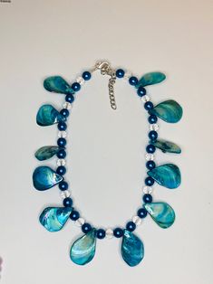 Ocean-inspired Blue Shell Jewelry, Ocean-inspired Blue Shell Beaded Necklaces, Blue Ocean-inspired Shell-shaped Necklace, Blue Shell-shaped Ocean-inspired Necklace, Ocean-inspired Blue Shell-shaped Necklace, Blue Shell Beaded Necklaces, Handmade Ocean-inspired Blue Shell Necklace, Adjustable Blue Shell Necklace For Gift, Adjustable Blue Shell Necklace Ocean-inspired