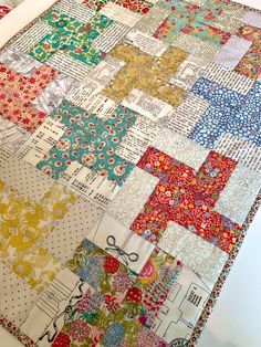 a close up of a quilt on a table