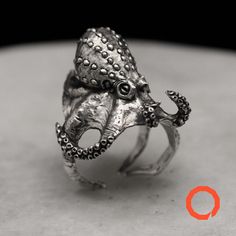 Dive into the mysteries of the depth with this captivating sterling silver ring, inspired by the mesmerizing form of the octopus. Crafted with meticulous detail, the ring showcases the swirling tentacles of the octopus, reaching out in a graceful dance. The smooth, polished silver evokes the shimmering scales of the creature, glistening with the secrets of the underwater world. More than just an accessory, this ring embodies the adaptability, intelligence, and enigmatic beauty of the octopus. It Fish Deep Sea, Octopus Ring, Ocean Inspired Jewelry, Handmade Jewel, Nature Water, Water Element, Animal Rings, Ocean Inspired, Handcrafted Rings