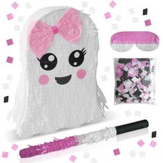 a paper bag with a pink bow on it and other items to make it look like a ghost